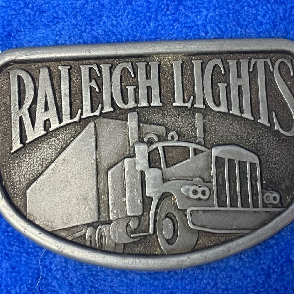 VINTAGE Metal “Raleigh Lights” Belt Buckle. Long Haul Semi Rig.